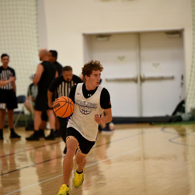 Panthers player pushing the ball in transition
